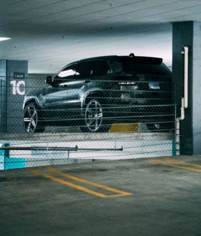 Black crossover SUV parked in the private parking facility at The Laundry Rooms hotel in Waterloo
